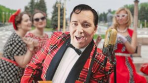Mr. King Eddy ist „Mr. Rock’n’Roll“ – mitreißendes 50s- & 60s-Entertainment für Firmenjubiläen, Oldtimerfeste und Geburtstage. Authentischer Sound, starke Bühnenpräsenz und 100 % Retro-Feeling machen ihn zur ersten Wahl für Events mit Stil und Nostalgie. Buchbar bei Eddy-Events.de | Willkommen bei Eddy-Events - Ihrem professionellen Partner für Premium Retro & Oldies Entertainment. Wir bieten Ihnen hochwertige Live-Unterhaltung mit King Eddy und seinem Team von talentierten Musikern und Sängern. Ob Kongresse, Tagungen, Messen, Galas, Kick-Off-Events, Awards, Festivals, Pressebälle oder Produktpräsentationen - wir sorgen dafür, dass Ihre Veranstaltung unvergesslich wird. Buchen Sie jetzt eine Liveband, Musik für Ihre Hochzeit oder einen Sänger für Ihren Geburtstag. Mit 40 Jahren Bühnenerfahrung und zahlreichen Auftritten, auch in bekannten TV-Formaten wie SAT.1, sind wir Ihr Highlight für jeden besonderen Anlass. Wir bieten eine große Auswahl an Künstlern und Musikern, um sicherzustellen, dass wir Ihre individuellen Bedürfnisse erfüllen können. Unsere professionellen Musiker und Sänger sind darauf spezialisiert, die besten Hits der 50er, 60er und 70er Jahre zum Leben zu erwecken und Ihre Gäste auf die Tanzfläche zu bringen. Wir haben alles, was Sie brauchen, um Ihre Feier zu einem unvergesslichen Erlebnis zu machen. Kontaktieren Sie uns noch heute für eine unverbindliche Anfrage und ein Angebot, das perfekt auf Ihre Bedürfnisse zugeschnitten ist. Bei Eddy-Events geht es nicht nur um großartige Musik und Unterhaltung - es geht auch darum, unseren Kunden eine herausragende Erfahrung zu bieten. Deshalb sind wir stets bemüht, Ihnen den bestmöglichen Service zu bieten und dafür zu sorgen, dass Ihre Veranstaltung ein voller Erfolg wird. Wir freuen uns darauf, Ihnen bei der Planung Ihrer nächsten Feier behilflich zu sein.